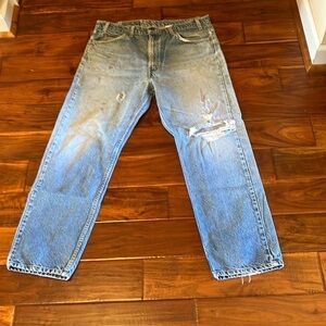 Men’s Levi’s orange distressed vintage jeans in size 37 x 30